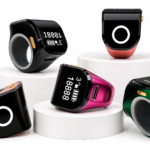 The image shows a Portable Ring Japa Counter with Android connectivity and touch display, featuring an adjustable ring design for comfortable use. This digital Naam Japa Counter helps track chanting data through a connected app and is suitable for Naam Jap, Jaap, meditation, prayer and mantra chanting.